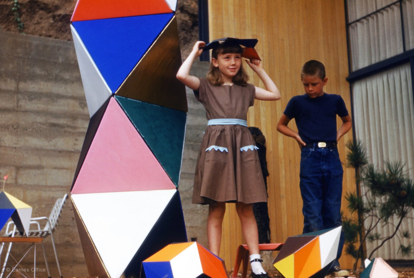 The Eames children playing with toys at their home